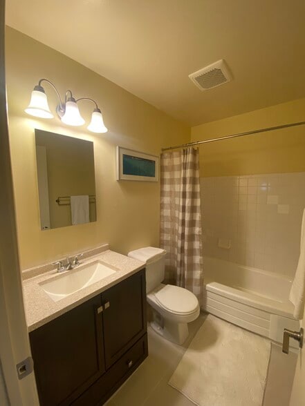 Updated bath with tile floors - 3833 Maybelle Ave