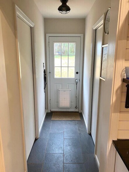 Back Hallway with laundry room on left and half-bath on right - 230 Pine Needle Rd