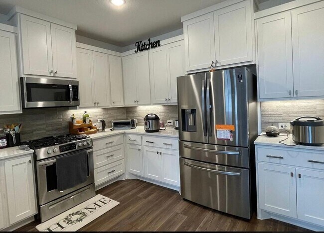 Building Photo - FULLY UPGRADED LUXURY TOWNHOME located in ...