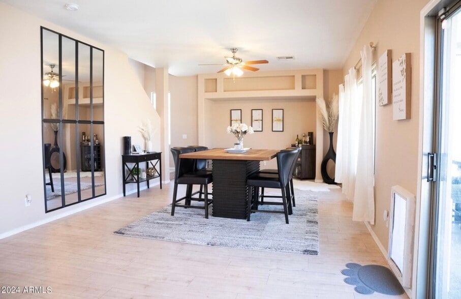 Spacious dining room area with built in dog door to back yard - 66 E Saddle Way