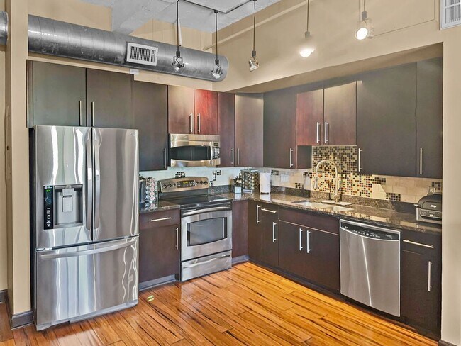 Building Photo - Modern Downtown Condo with Stunning City V...
