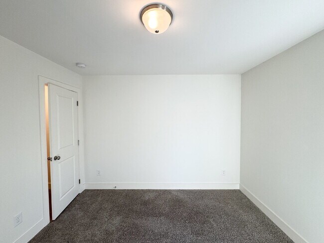 Building Photo - Stylish 3BR Townhome with Private Yard & T...