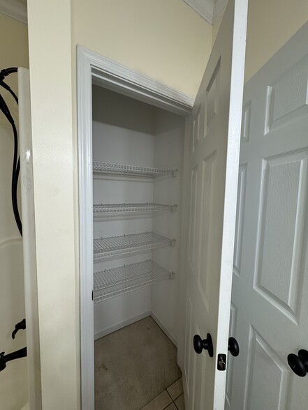 2nd full bath linen closet. - 1701 Water Oak Dr