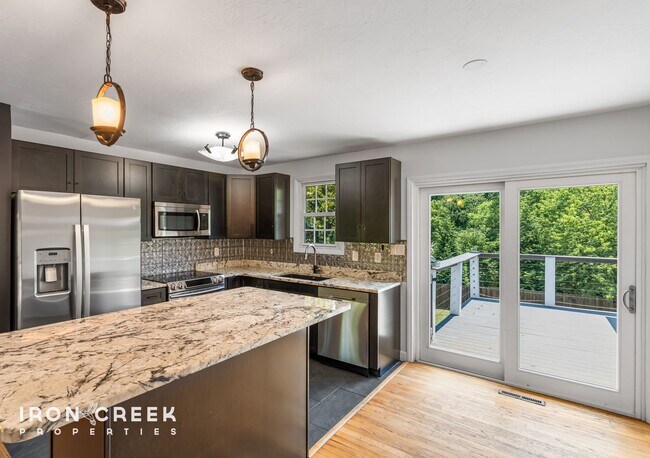 Building Photo - Beautifully Updated Three-Bedroom with Koi...