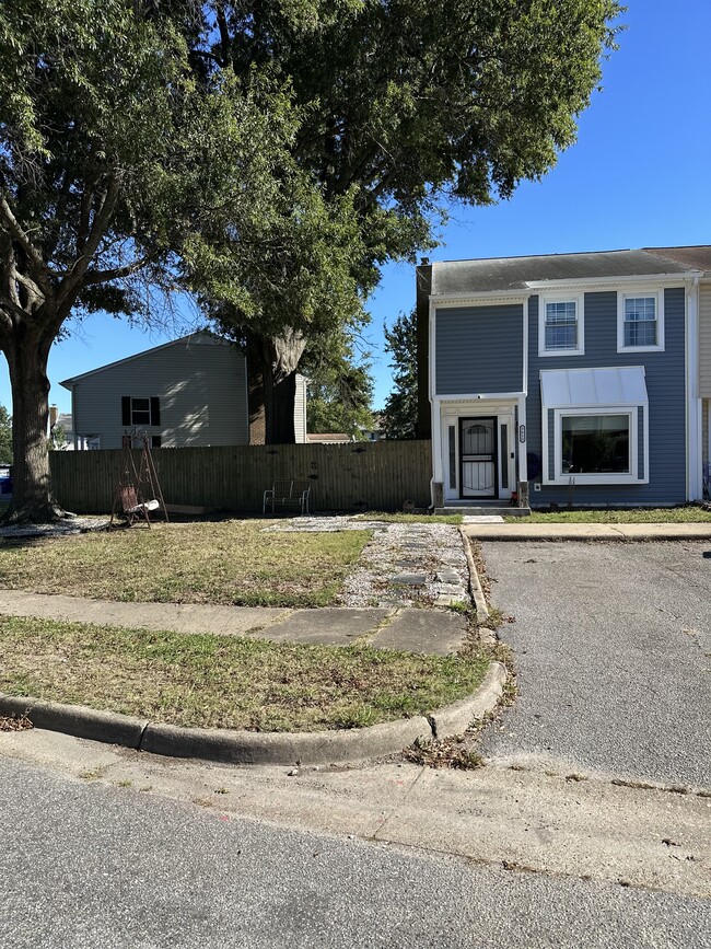 Corner townhouse, parking spaces, and side yard - 3613 Harbinger Rd