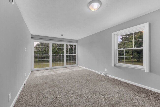 Building Photo - spacious 4-bedroom, 2.5-bath home featuring a 2-car garage and fresh updates throughout.