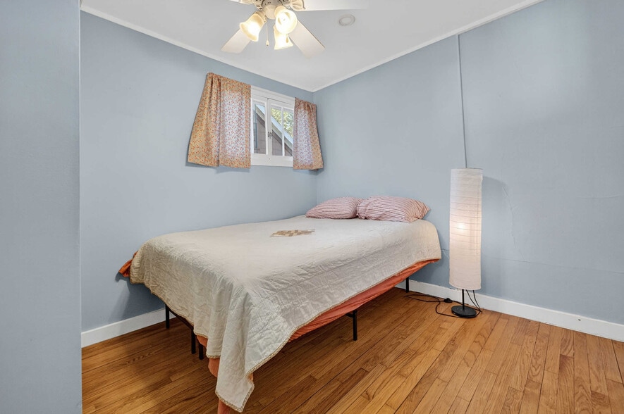 Bedroom #2 bodes high privacy windows to the north and west plus a ceiling fan. - 302 Van Deusen St