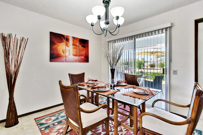 Enjoy views of your desert oasis while dining or combine both areas for entertaining guests. - 12414 W Nugget Ct