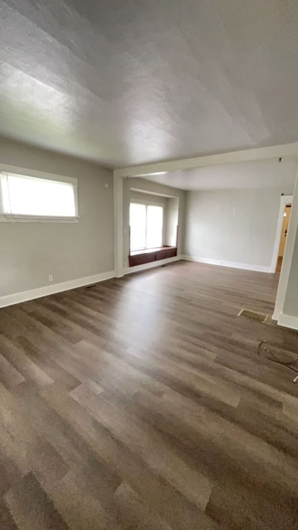 Building Photo - Fenced in Backyard + Garage