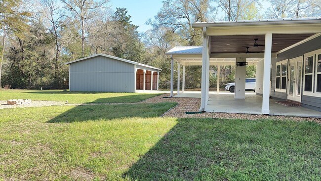 Building Photo - Available Now: Expansive 4BR Home with Rare 3-Bay Carport