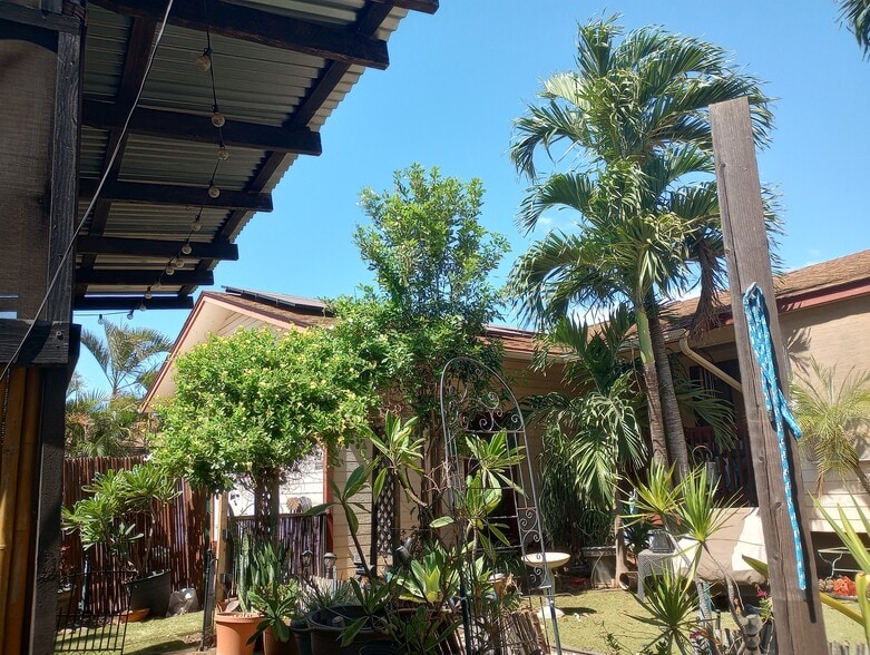 Front of Mainhouse from front garden right side. Lots of Palms, flowers, trees here. - 281 Kaikea St