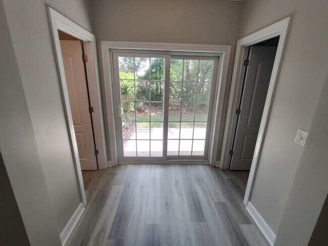 Building Photo - BRAND NEW FLOORING & FRESH PAINT - 3 Bedroom/2.5 Bath Townhome with garage in Wild Wing!