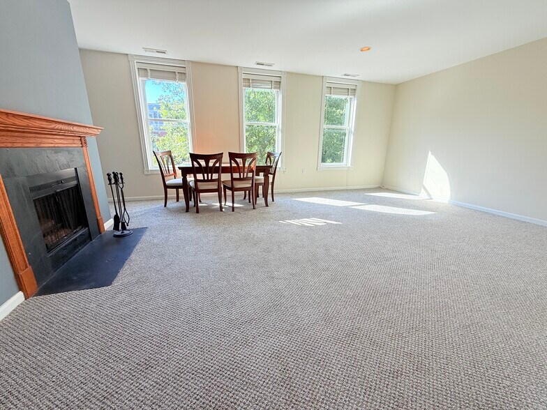 Living room w/ three large windows - 1331 Vermont Ave NW