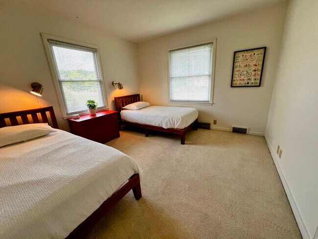 The front bedroom has two twin beds and a closet with lots of storage space. - 228 W Lexington Blvd
