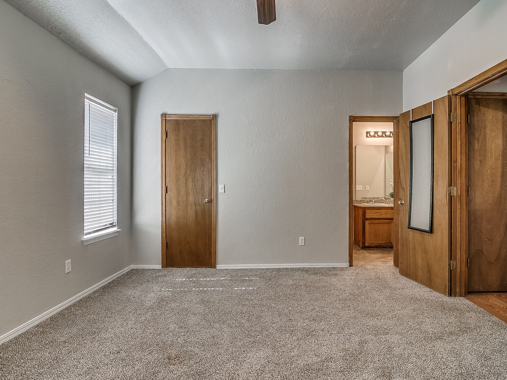Master bedroom with walk-in closet and master bath - 1821 Overland Trail