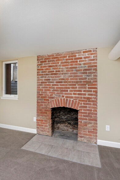 fireplace is now painted white - 915 Clarkson Street