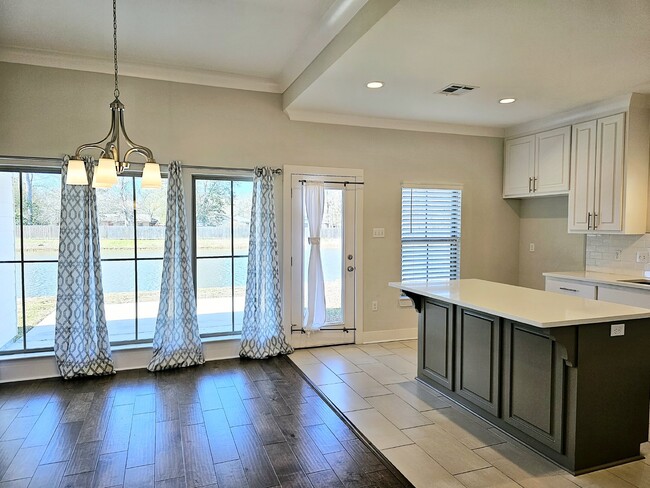 Building Photo - Stunning 4-Bedroom Waterfront Home with Granite Countertops and Hardwood Floors in The Sanctuary ...