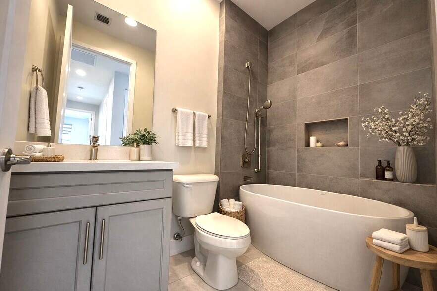 bathroom with tub - 15377 Green River Ct