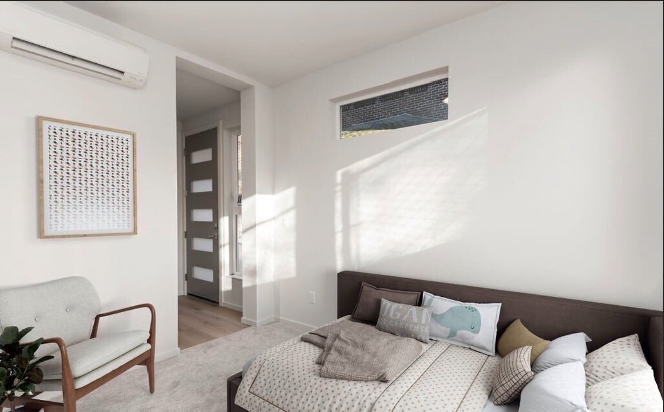 Bedroom connects directly to main living area, creating an open flow. - 2921A Franklin Ave E