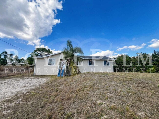 Building Photo - 4 Bedrooms, 2 Bathrooms & a Huge Backyard — Spacious Lehigh Acres Home with Pet-Friendly Living o...