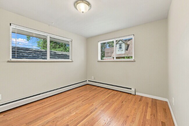 Building Photo - AVAILABLE NOW  Spacious 4-Bedroom Wheat Ridge Home with Finished Garden Level, Two-Car Garage & B...