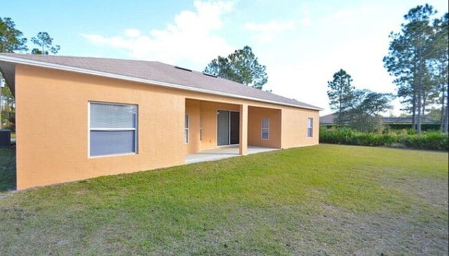 Building Photo - "Spacious 4-Bed Oasis in Palm Coast with 2...