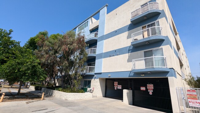 Front of building and gated entry into garages - 214 S Alexandria Ave