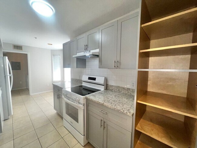 Building Photo - NEW-Remodeled bathroom & kitchen! NEW VINYL PLANK flooring & fresh paint! 2 bedroom 1 bath condo ...