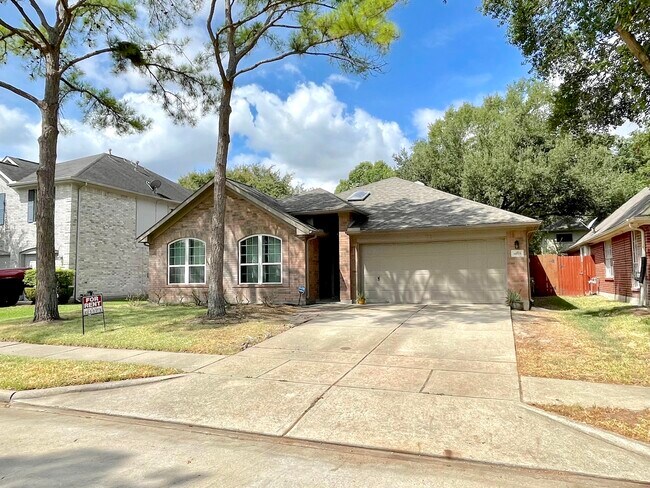 Large driveway and attached two car garage - 14511 Enola Dr