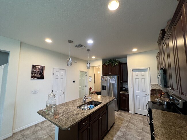 Building Photo - "Spacious 4-Bedroom Lutz Home with Elegant...