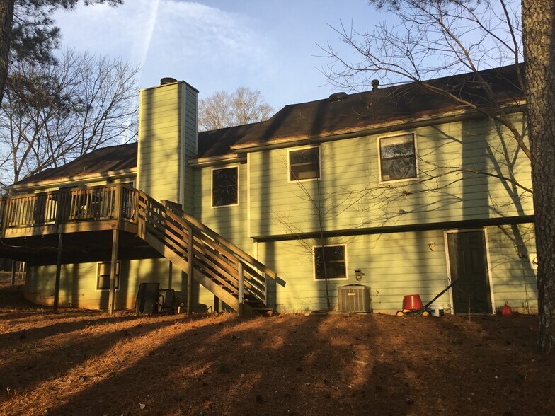 Back of house with large deck - 1273 W Wylie Bridge Rd