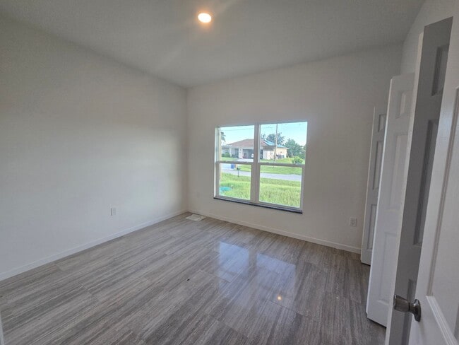 Building Photo - Brand New 2/2/1- Great SW Lehigh Acres Loc...