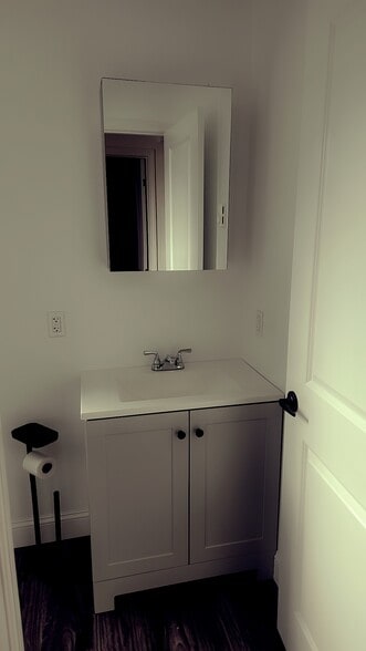 Bathroom vanity with lighted mirror - 806 N Ann St