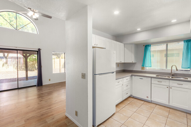 Kitchen open to living area - 3748 W Carol Ann Way