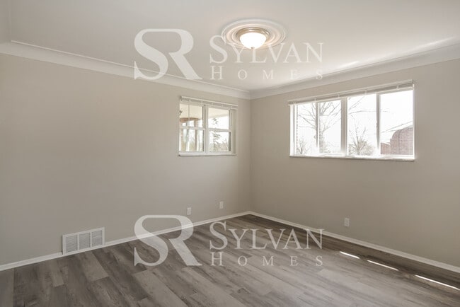 Building Photo - Welcome to this charming abode.