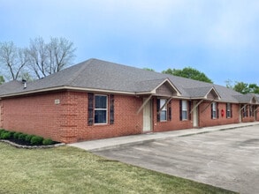 Building Photo - The Oaks: Water &amp; Sewer Included