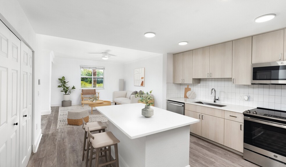 Select homes feature upgraded kitchens with quartz countertops - City Center on 7th