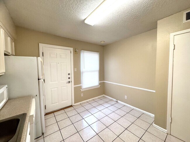 Building Photo - Single-level living on ground floor  |  Fresh paint (July 2026)  |  2 carports  |  Community Pool...
