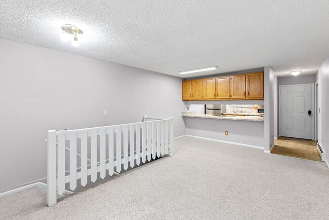 Building Photo - Students Welcome! Spacious 2-Bedroom Condo with Garage and Basement
