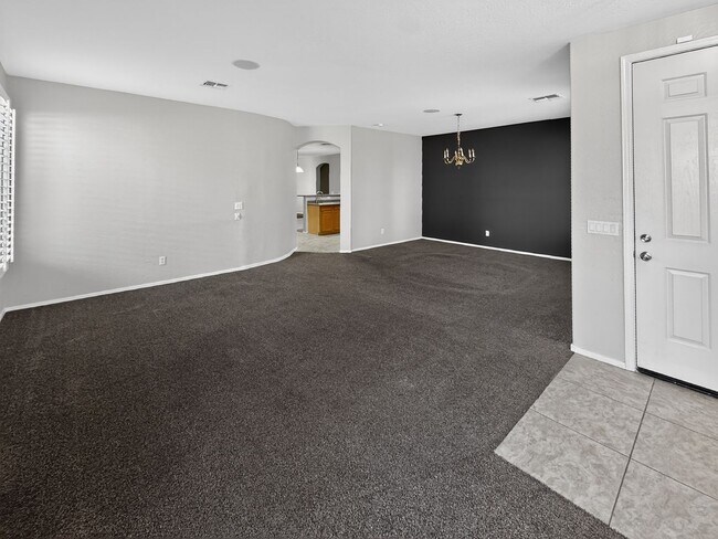 Building Photo - Single-level 4 bed, 2 bath home with tandem 3-car garage and RV gate.