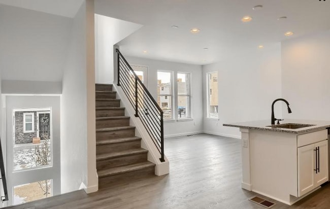 Hard wood floor/metal holders - 20999 E Quincy Dr