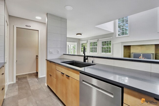 Building Photo - Spacious and bright condo located in a quiet area that boasts the perfect combination of style an...