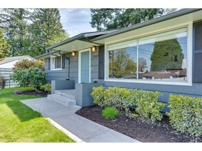 Building Photo - Stylishly Updated Mid-Century Gem on a Qui...