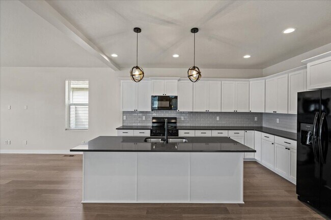 Building Photo - Brand New, Stylish 4-Bedroom Home with Vaulted Ceilings and Private Patio