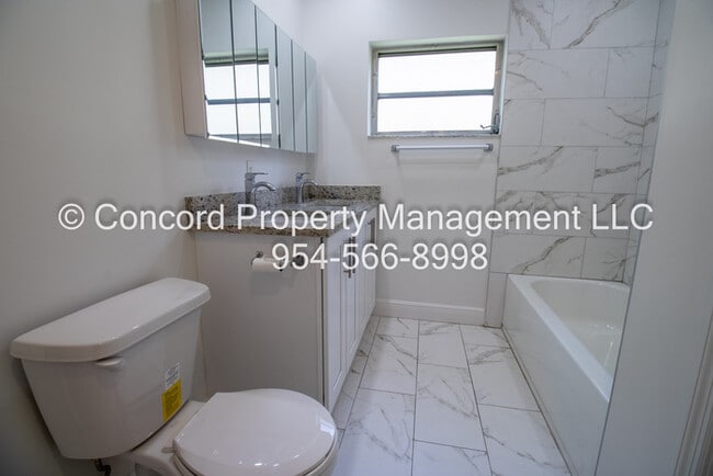 Building Photo - Holiday Special-Updated 2 BR- Open Layout- Island Kitchen-Pool- Central AC