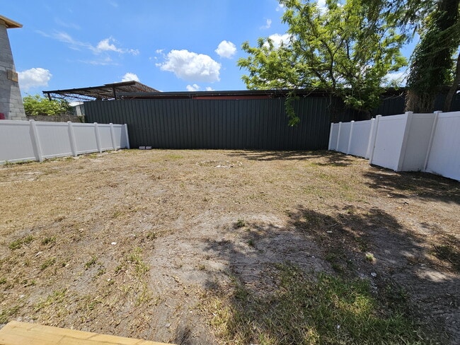 Building Photo - fully renovated 2-bedroom, 1-bathroom home with bonus guest room or office and oversized fenced yard