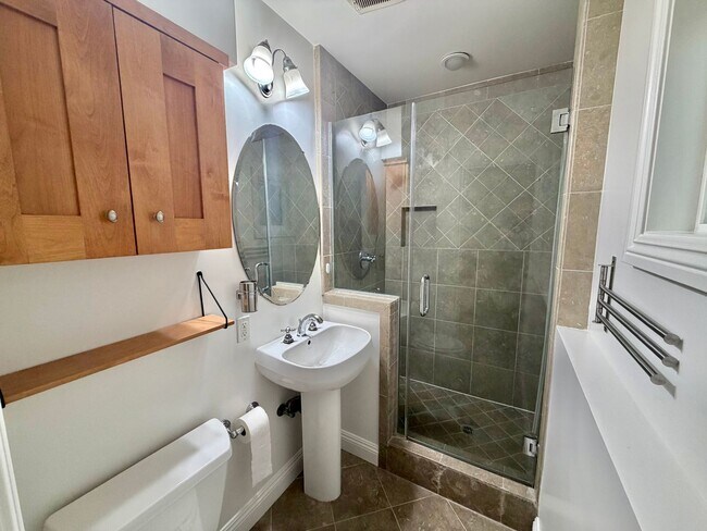 Building Photo - Beachside Living Just One Block from the Sand – Updated 1BD with Garage Parking