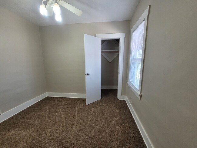 Building Photo - Four bedroom home on Indianola Ave with large yard and two decks!