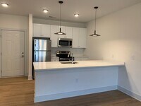 Building Photo - Beautiful Brand New Three Bedroom Apartment!