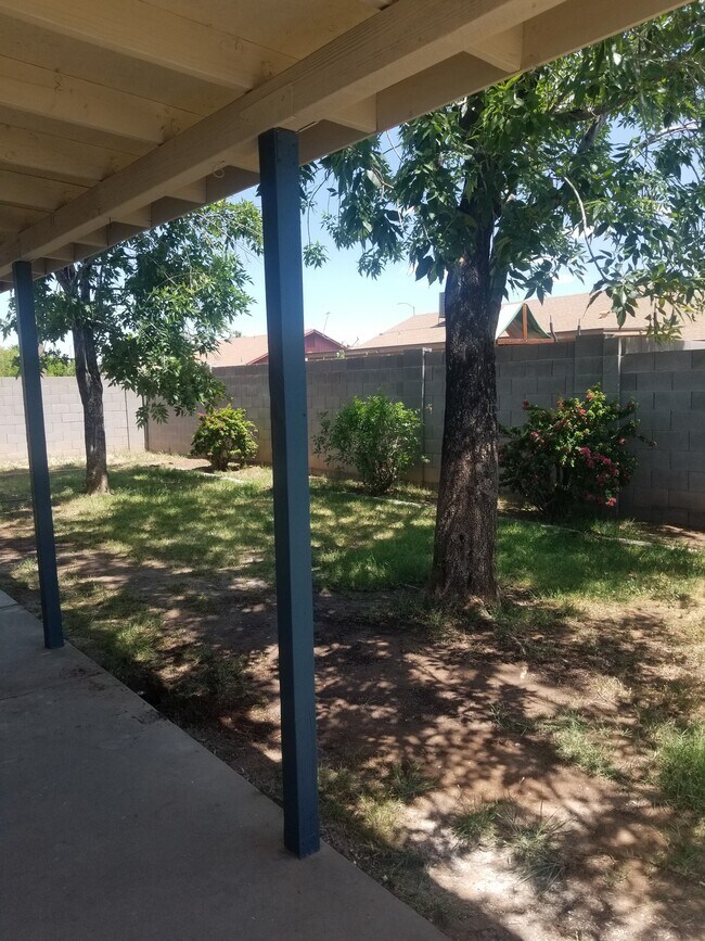 Shady backyard with large covered patio - 1819 S Windsor